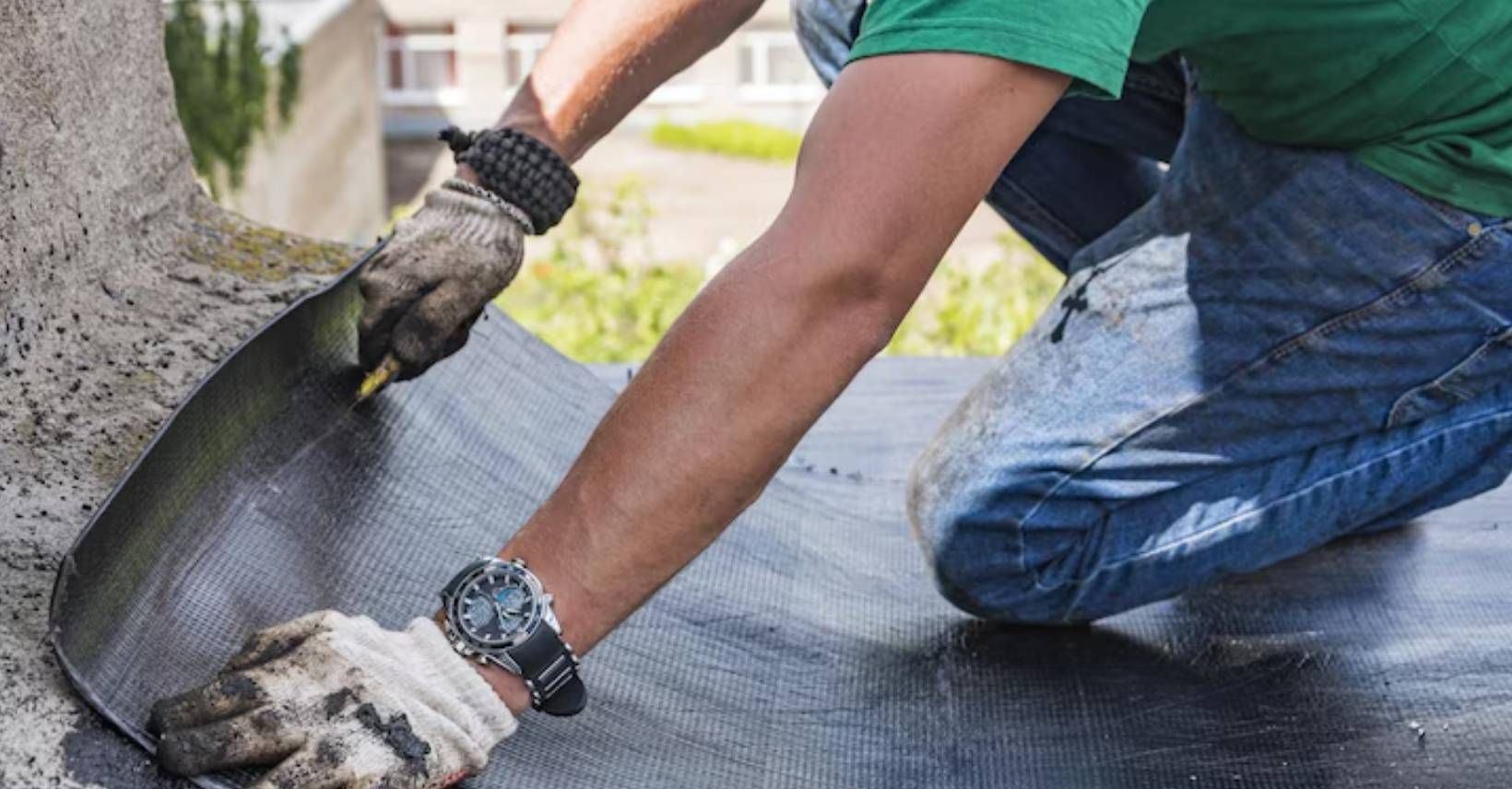 Waterproofing membrane being applied to an exterior foundation wall